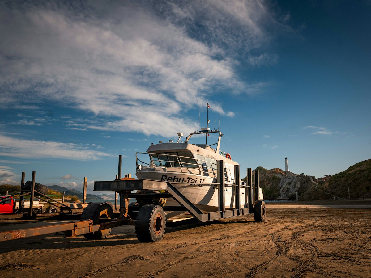 Boat on a trailer being towed by road
